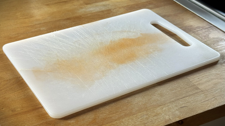 white plastic cutting board on a table