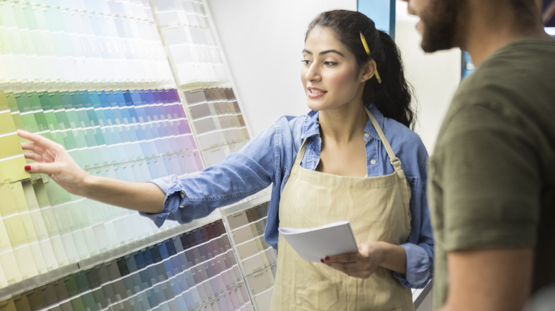 People looking at paint colors
