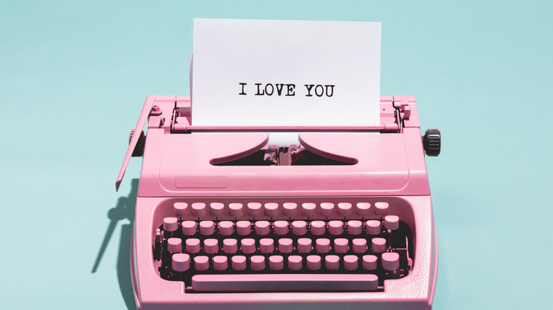 pink typewriter writing "I love you"