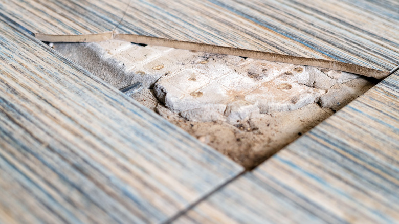 Cracked asbestos cement floor tile