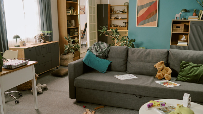 The inside of a messy open plan home.