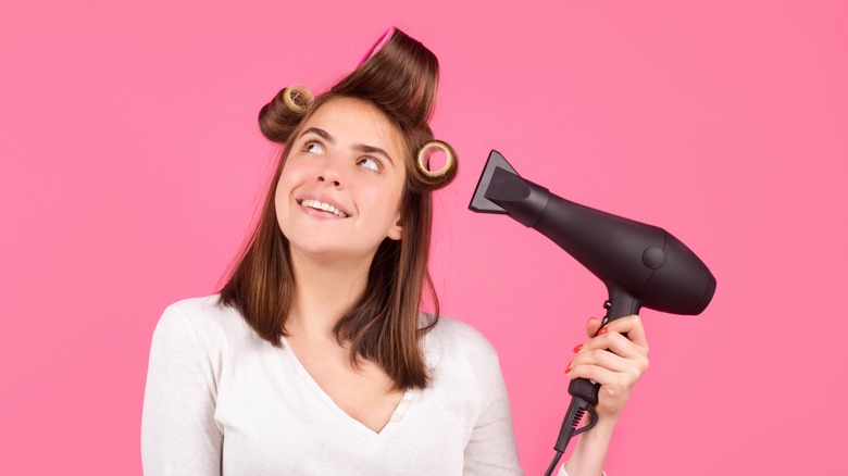 Woman with hairdryer