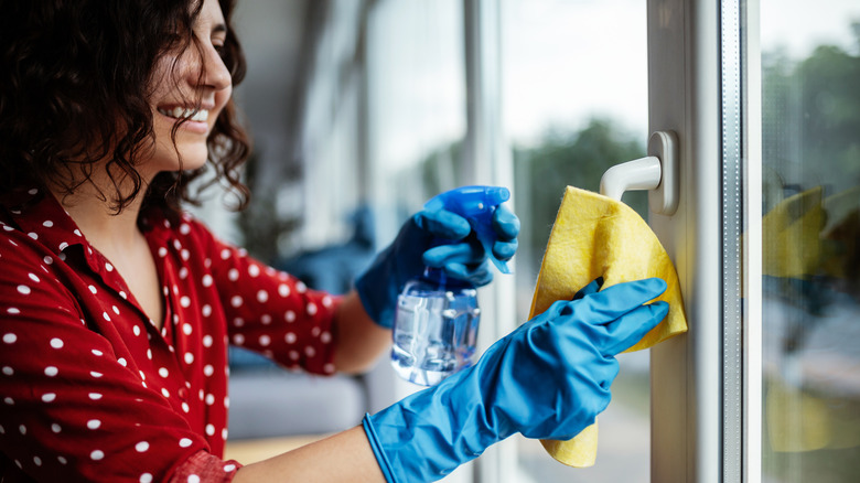 Women cleaning windows with chamois