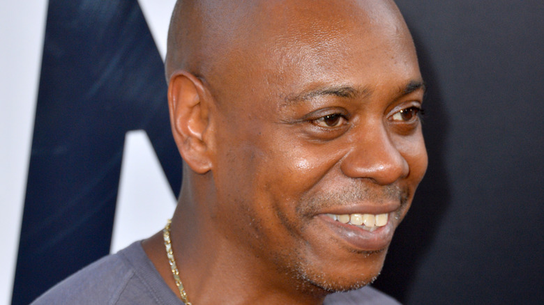Dave Chappelle poses at Golden Globes