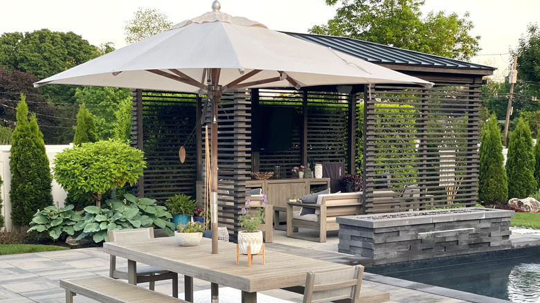 Backyard patio area with an umbrella