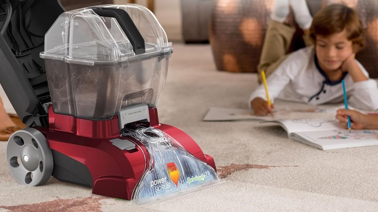 the Hoover PowerScrub Deluxe cleaning spilled drink off carpet