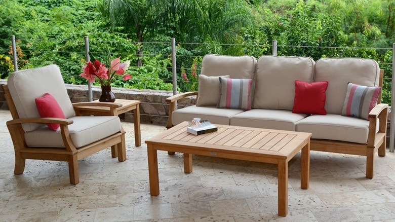 Outdoor teak dining wood set on waterfront