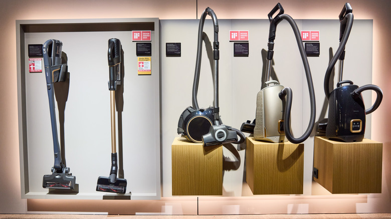 Multiple Miele vacuum cleaners in a showroom on display