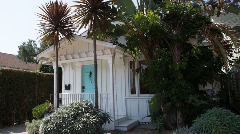 white cottage with blue door