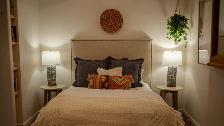white bed with boho pillows 