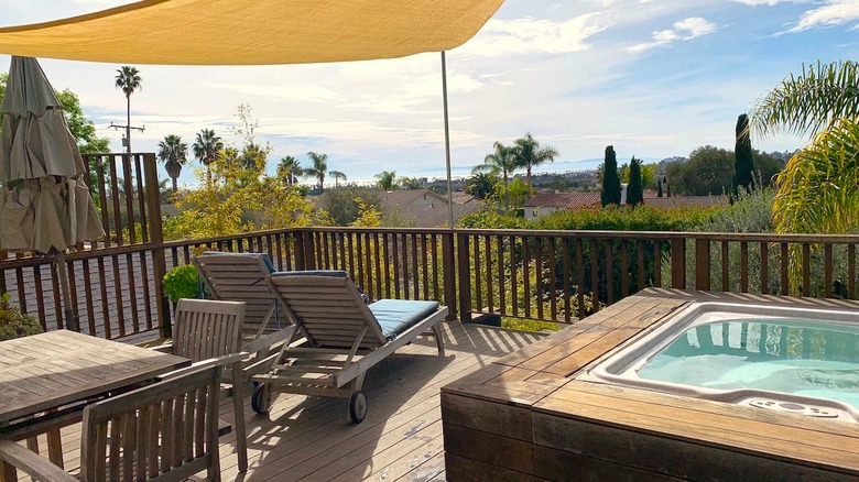 hot tub on patio overlooking ocean