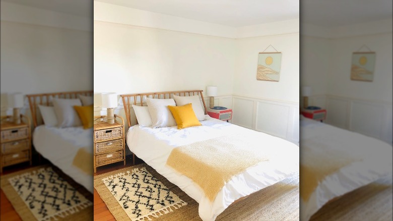 white bed with yellow blanket 