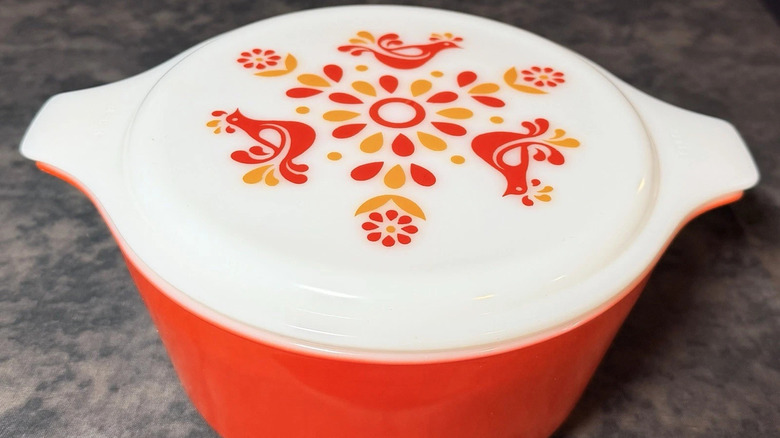 'Friendship' Pyrex casserole dish with a red and orange pattern.
