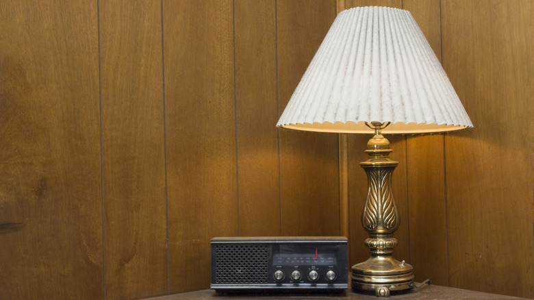 Vintage table lamp with brass base and white fluted shade