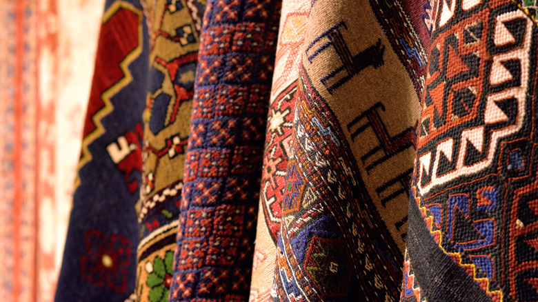 Close up of Turkish rugs hanging up