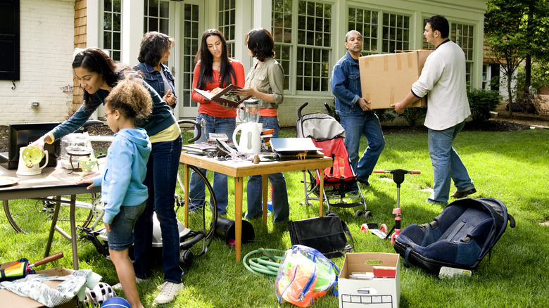 people shopping outside of house