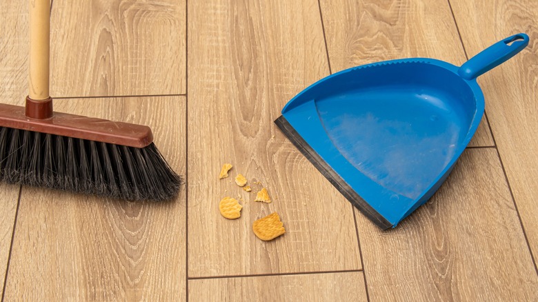 Sweeping up crumbs and broken crackers