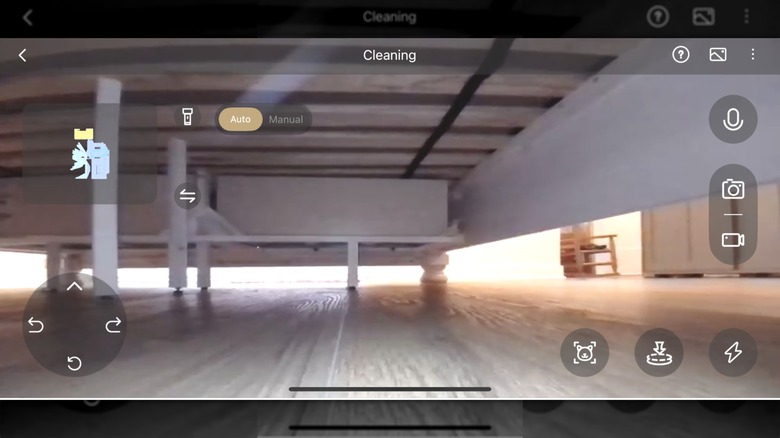 Screenshot of MOVA app "camera monitoring" feature, showing the vacuum's live camera footage while cleaning under the bed
