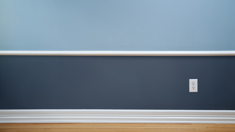 empty room with two-tone wall with white trim