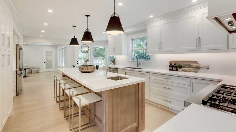 A wide angle look at a modern, sleek kitchen