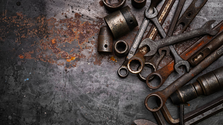 rusty tools on rusty surface