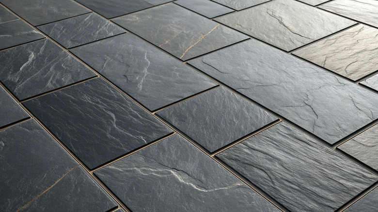 Close-up view of dark slate tile flooring