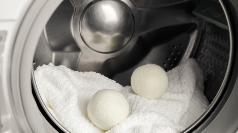 Wool dryer balls in dryer with towels