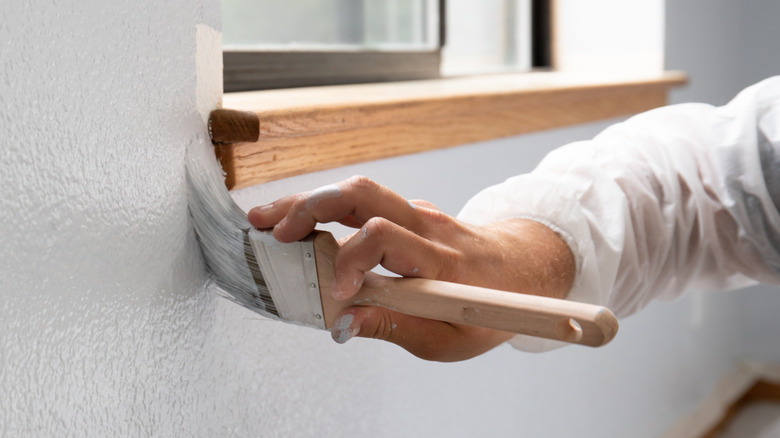 Hand painting a wall