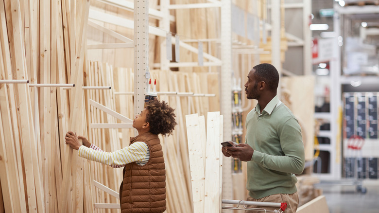 man and child shop at hardware store