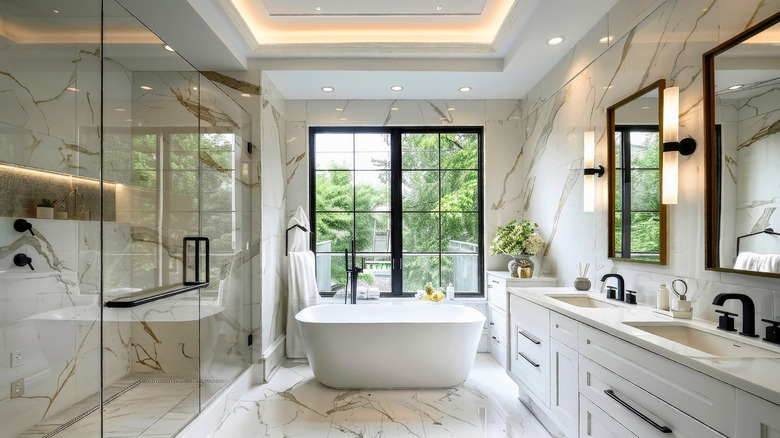 A luxury marble bathroom with a freestanding tub and a large walk-in shower