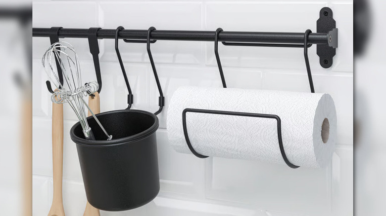 The IKEA Hultarp collection: A kitchen rack, utensil container, and paper towel roll all in black