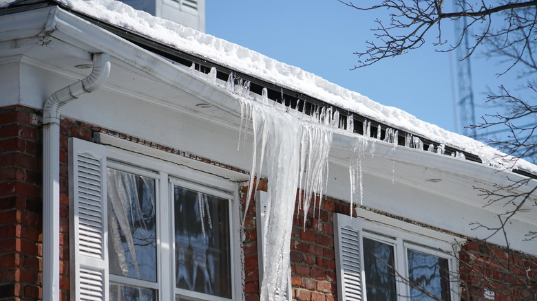 An ice dam hanging off gutters.