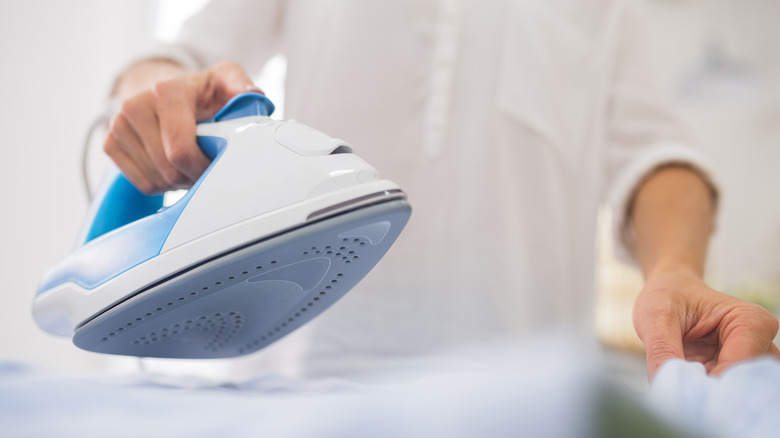 Person ironing clothes