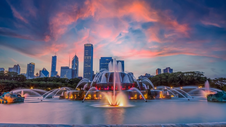 fountain foregrounding chicago skyline sunset