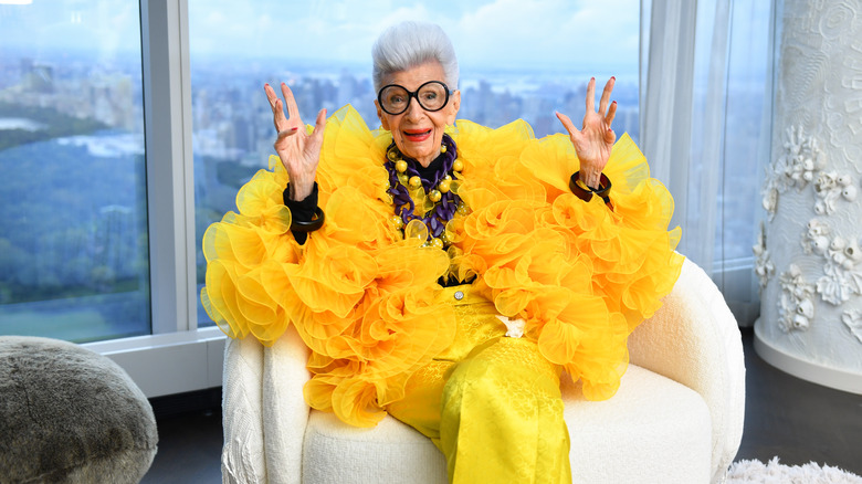 Iris Apfel wearing yellow outfit