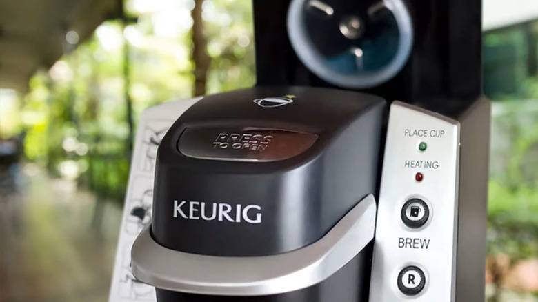 closeup of a keurig coffee maker brew buttons displayed