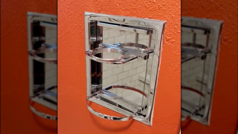 close up of 1950s vintage recessed chrome toothbrush holder