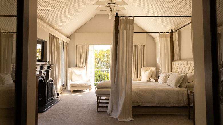 A chic bedroom with a canopy.