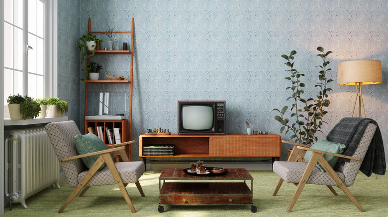 Old TV on mid-century stand in living room