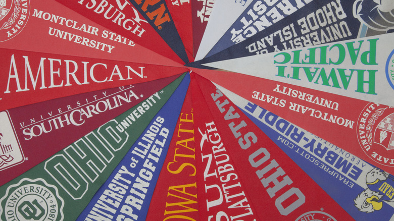 A bunch of pennants from different schools
