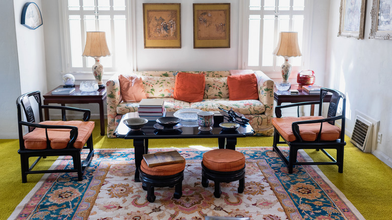Vintage living room with two chairs and sofa with flowery pattern