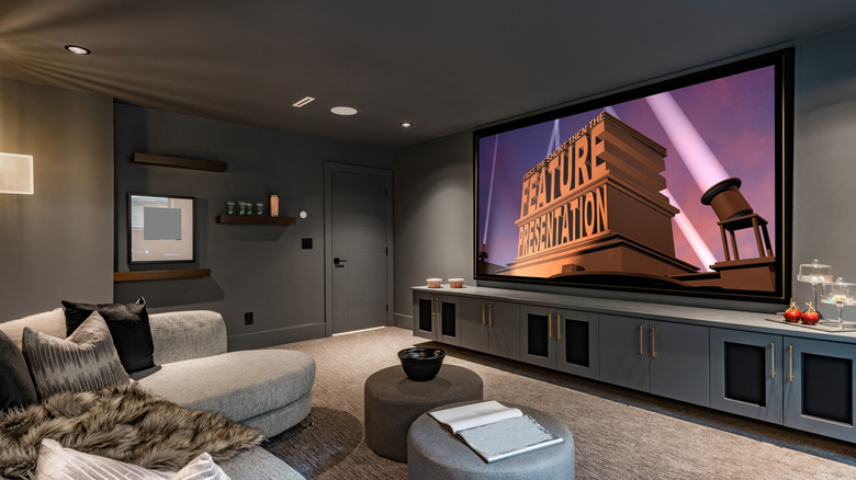 A home theater room with the TV turned on.