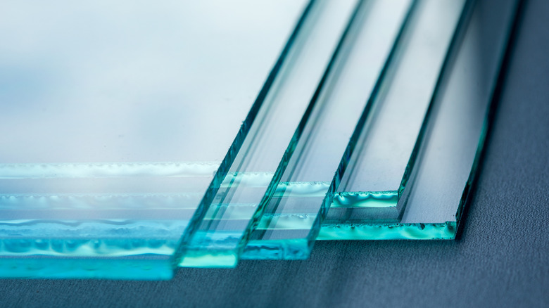 Sheets of glass stacked on top of each other.