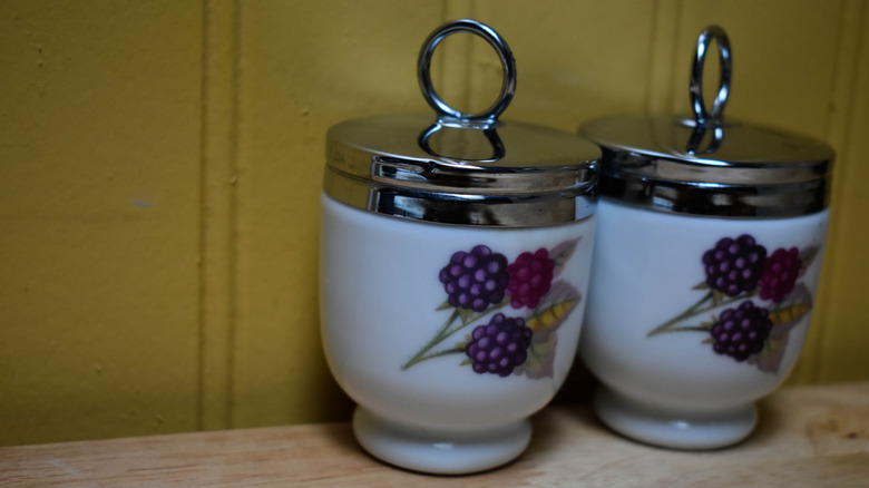 Closeup of two egg coddlers