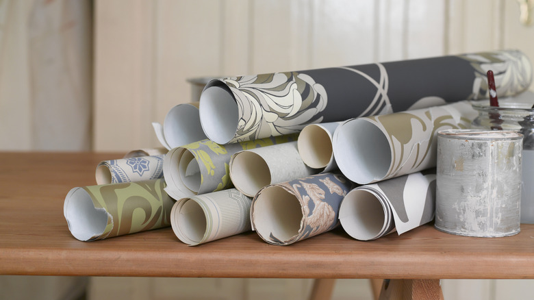 Rolls of wallpaper on a wooden bench