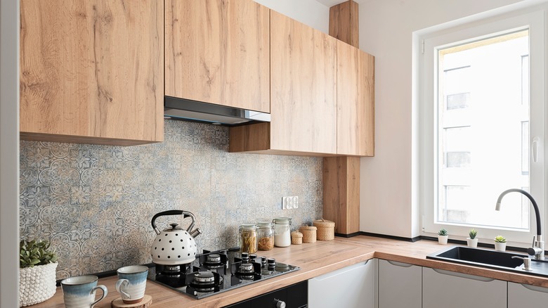 Natural wood cabinets in modern kitchen