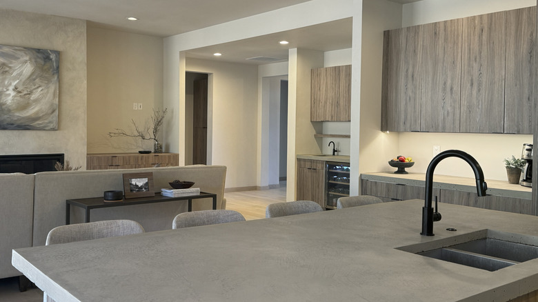 Modern open concept kitchen space that opens to living room