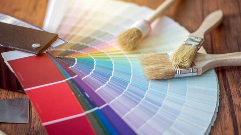Color swatches and paint brushes on a table