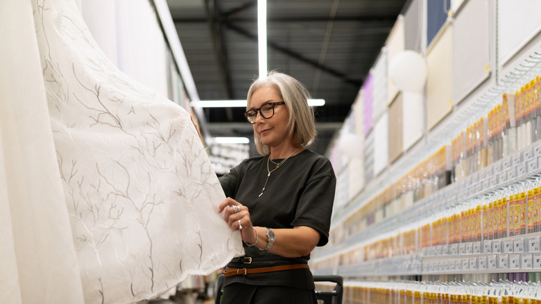 woman shopping for new curtains