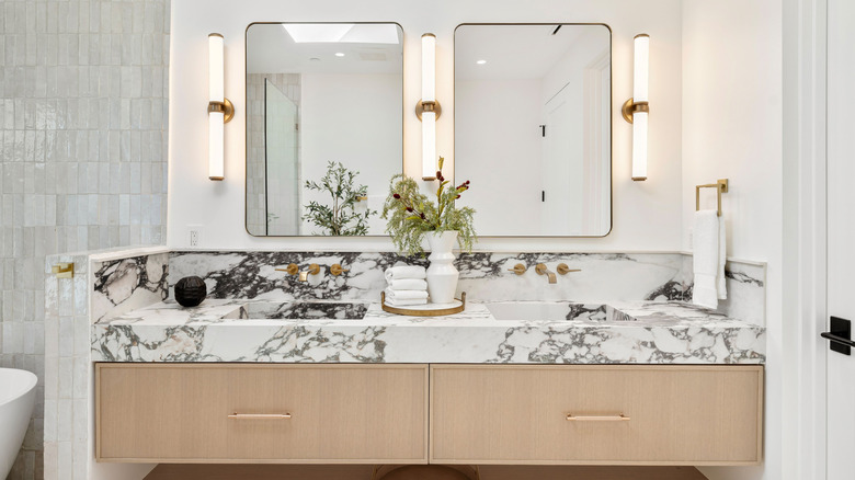Bathroom vanity with marble countertop and integrated marble sinks